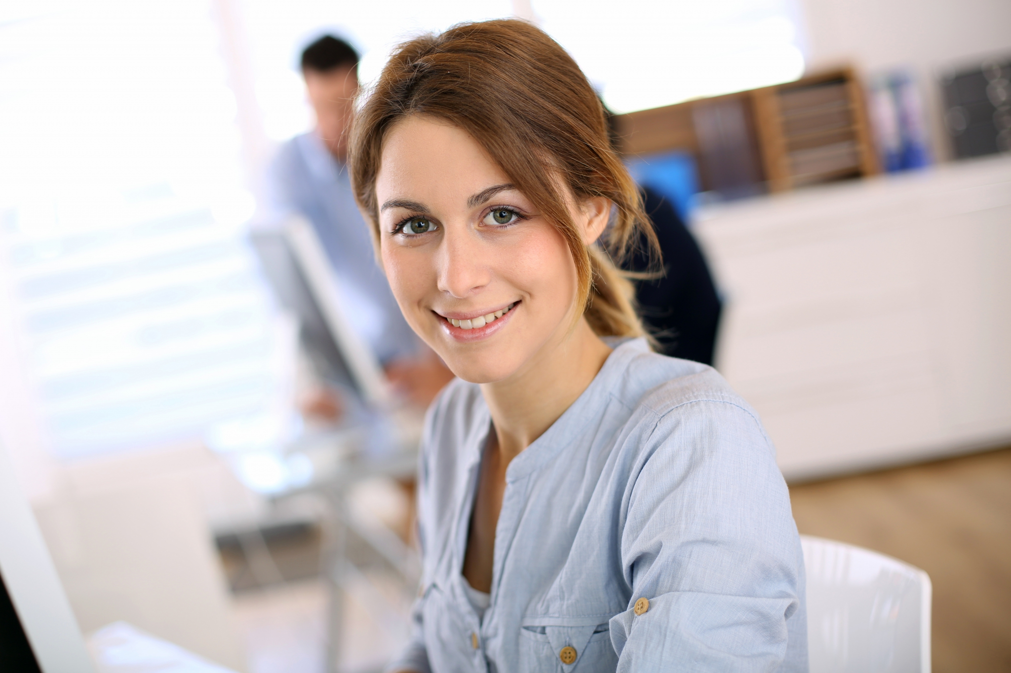 Portrait of cheerful girl in office Portrait of cheerful girl in office