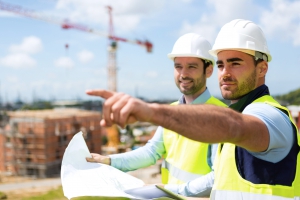 View of a Worker and architect watching some details on a construction