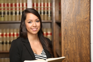 Young Female Hispanic Lawyer in Law Library