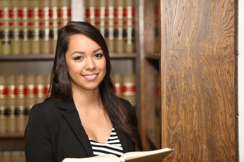 Young Female Hispanic Lawyer in Law Library knk