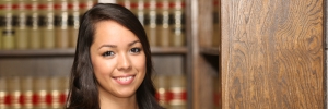 Young Female Hispanic Lawyer in Law Library.